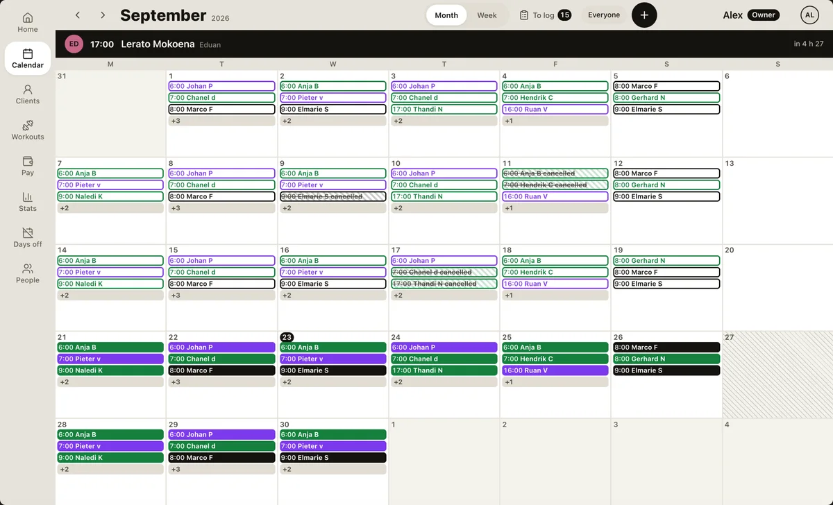 Personal training system on a laptop: the month's calendar across every trainer